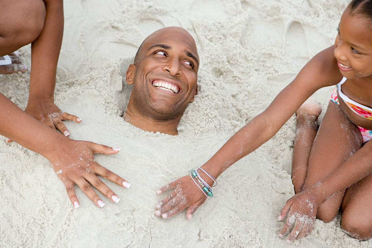 Travelling with high cholesterol: Father buried on the beach by kids